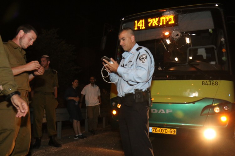 bus window smashed by rocks thrown by Arabs