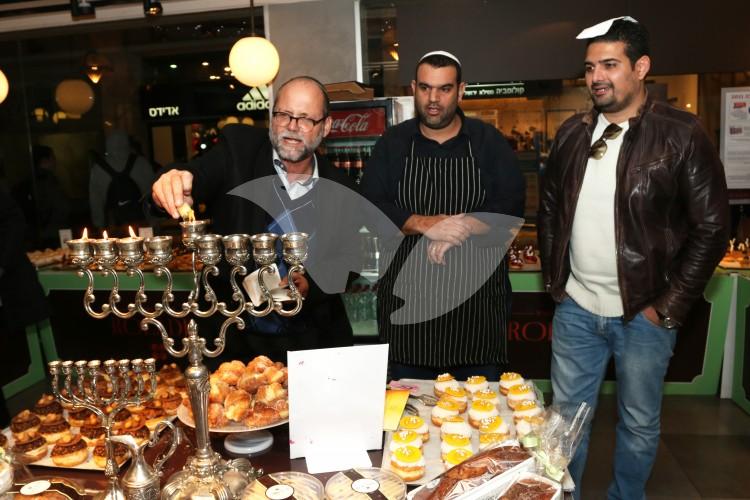Hanukkah candle lighting at Roladin cafe, Mamilla Mall, Jerusalem
