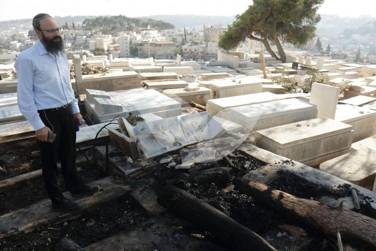 MK Hillel Horowitz Stands Over Burned Gravesites on The Mount of Olives