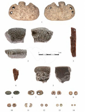 Special items uncovered: perforated piece, decorated objects, green stone spacers, shell and disc beads
