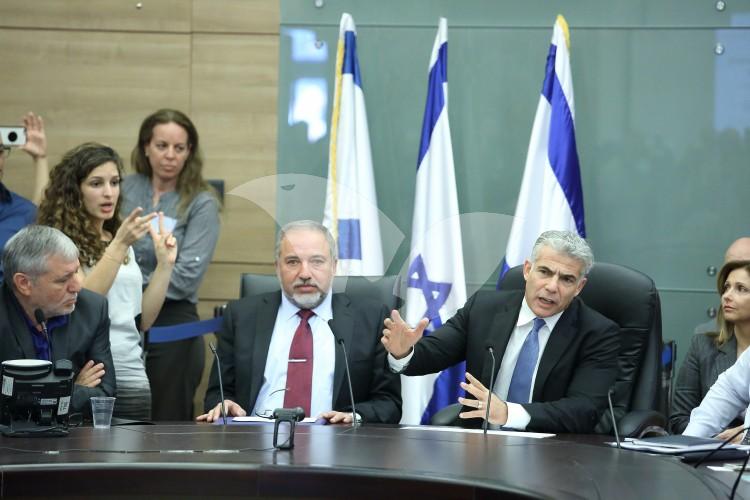 MK’s Yair Lapid and Meir Cohen of Yesh Atid with Avigdor Liberman of Isrel Beytenu