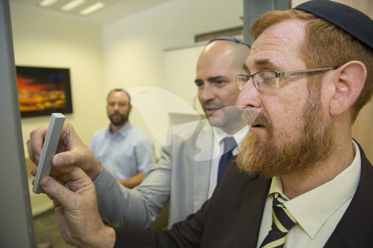Yehuda Glick and Amir Ohana, Likud Knesset Members, Hanging Mezuzah in Glick’s Office