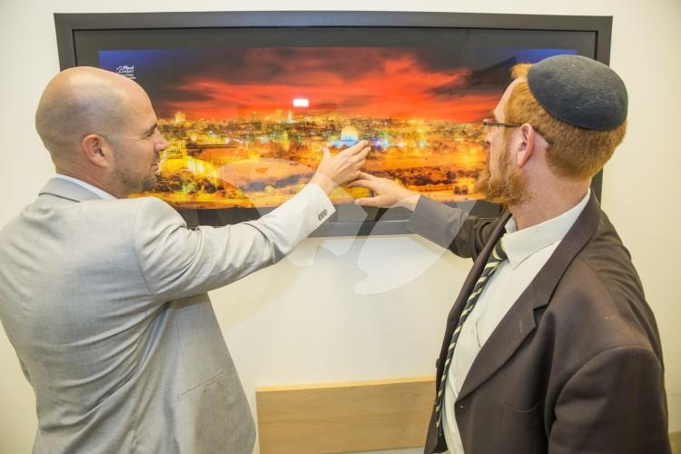 Yehuda Glick and Amir Ohana, Likud Knesset members, pointing to Temple Mount in Glick’s office