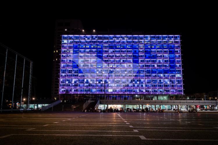 The Tel Aviv municipality building is lit up with the words Peres and Peace