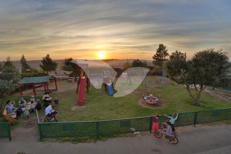 Sunset and Playground in the Amona Community