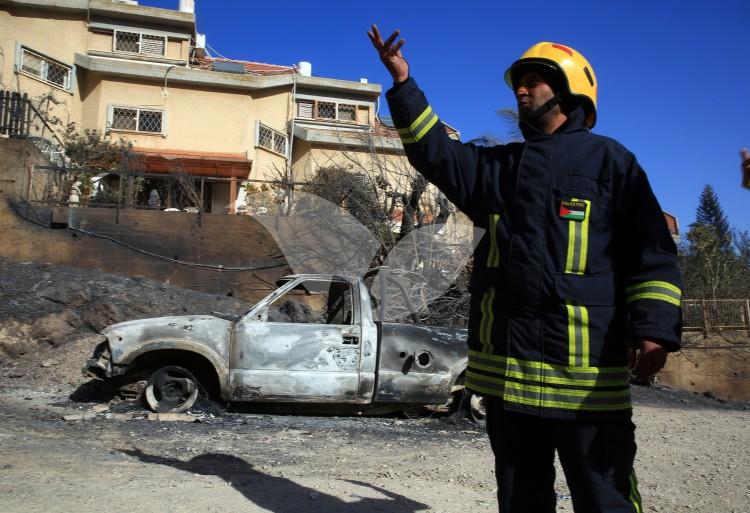 Palestinian firefighters assit in dousing Haifa fire