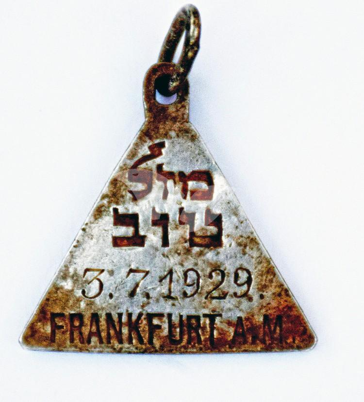 The pendant with the Hebrew words “Mazal Tov” and the date July 3, 1929