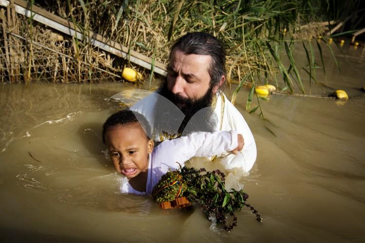 Christian Orthodox pilgrims participate in the baptism of Jesus,