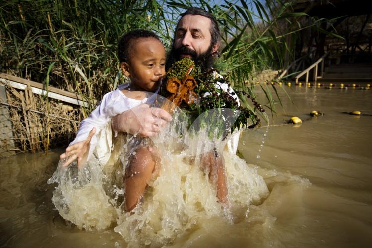 Christian Orthodox pilgrims participate in the baptism of Jesus,