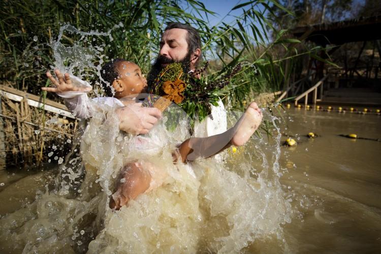 Christian Orthodox pilgrims participate in the baptism of Jesus,