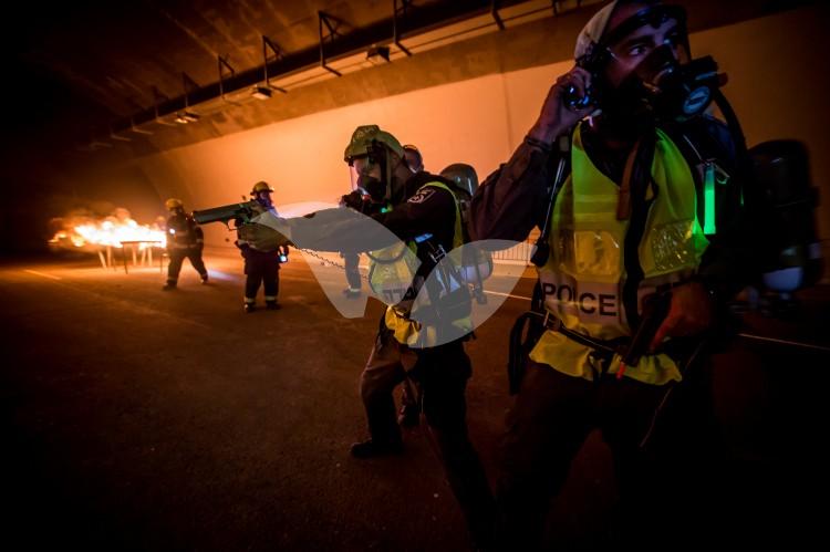 Police, firefighting teams and emergency services train for rescuing hostages from burning bus. Highway 1 Harel Tunnel, Jerusalem