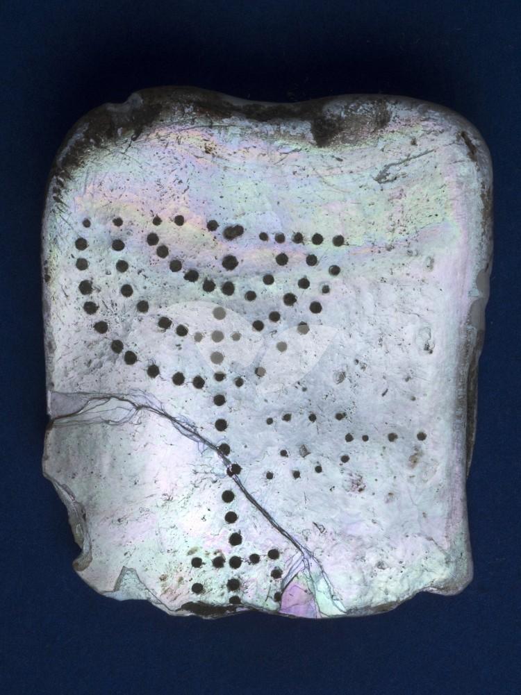The small tablet engraved with a seven-branched menorah and a coal pan