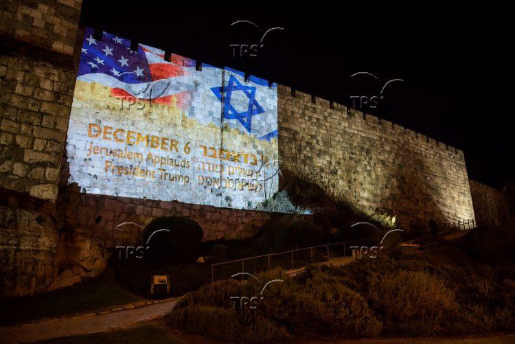 US and Israeli flag on the walls of Jerusalem’s Old City