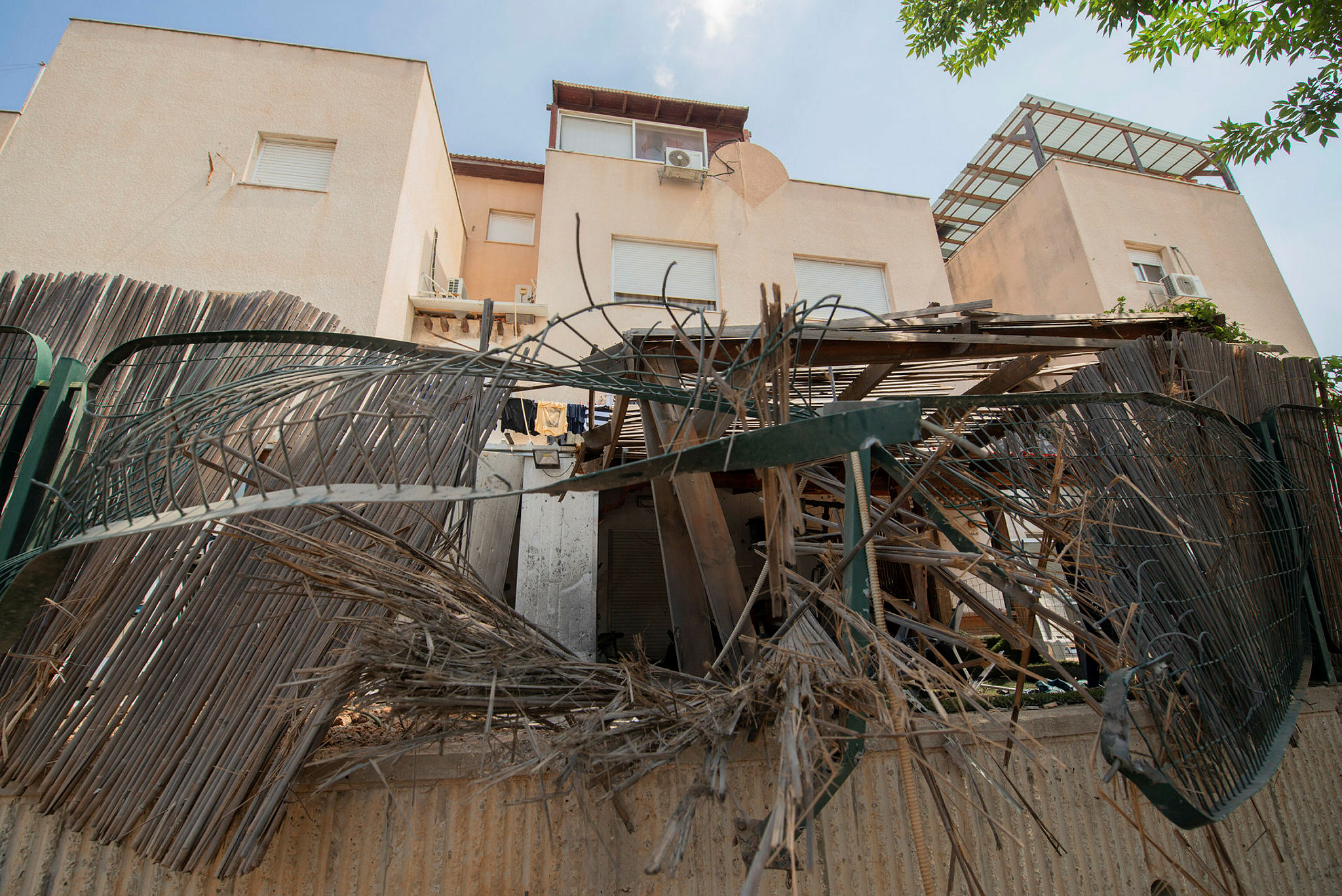 A rocket launched from Gaza causing damages to property