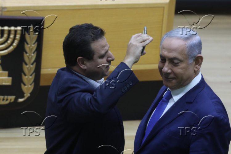 MK Ayman Odeh places camera in PM Benjamin Netanyahu’s face during debate on bill legislating filming in polling stations 2019-09-11