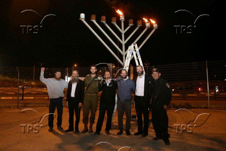 Lighting the 2nd candle of Hanukkah at Tappuah junction