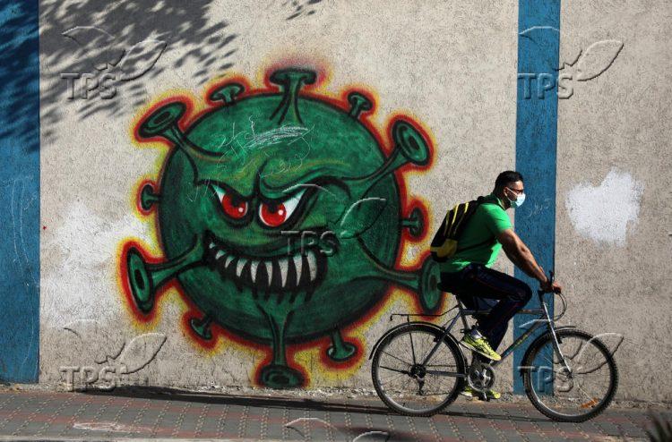 Graffiti depicting the COVID-19 coronavirus in Gaza city