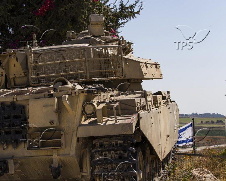 Israeli tank patrolling Syrian border
