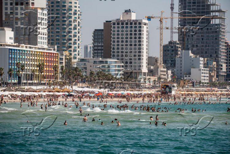 Israelis and tourists enjoy the beach in Tel Aviv Publich beach