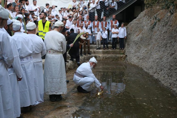 People in Jerusalem perform the ancient water pouring ceremony
