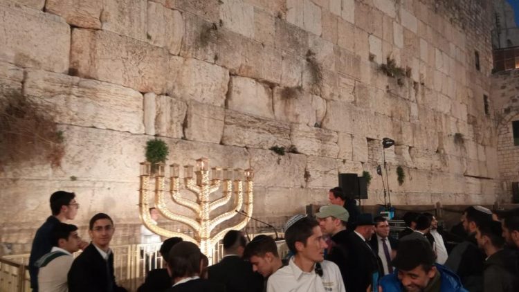 Lighting the first candle of Hanukkah at the Western Wall