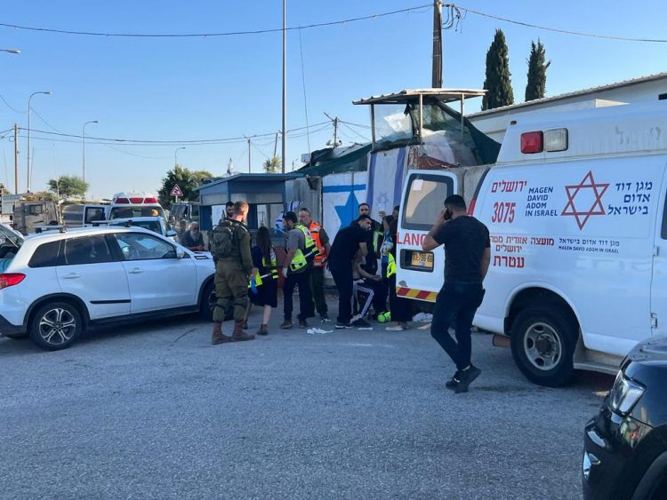 Israeli paramedics provide treatment to a Palestinian man
