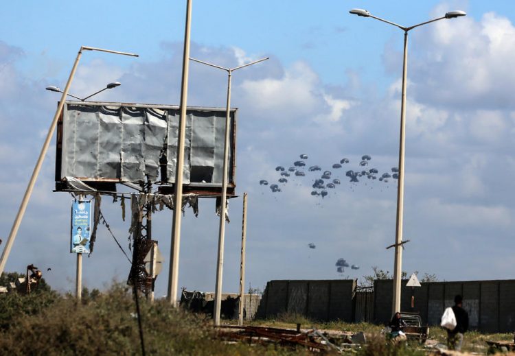 U.S. cargo planes drop humanitarian aid into the Gaza Strip
