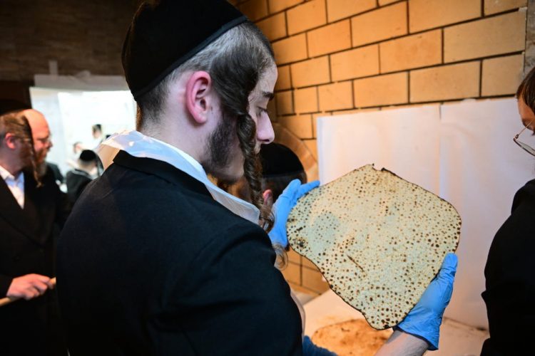 Baking Matzos for Passover 2024 by Kretshnif Chassidim
