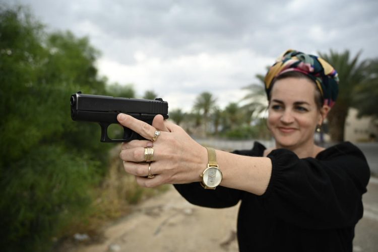 Woman shoots at a shooting range